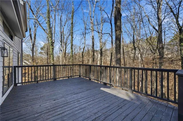 a view of deck with wooden floor and fence