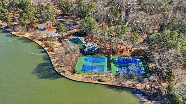an aerial view of a house with a lake view