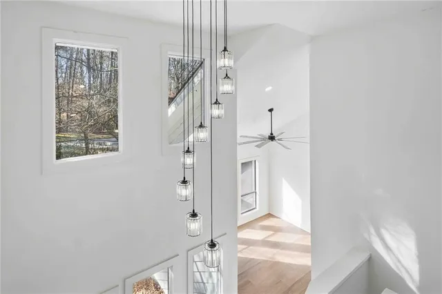 a view of entryway and hall with wooden floor
