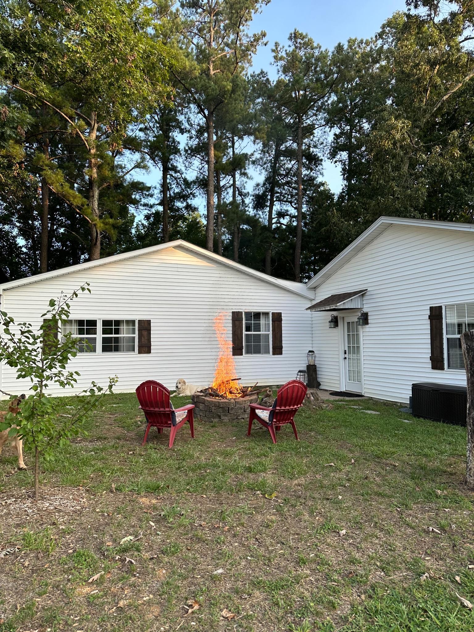 6045 Green Road Bloomington Springs, TN 38545 - Photo 57 of 69 a backyard of a house with table and chairs