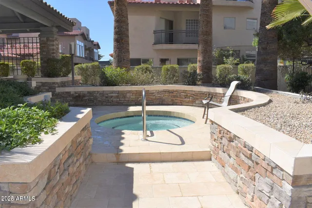 a view of a swimming pool with a patio