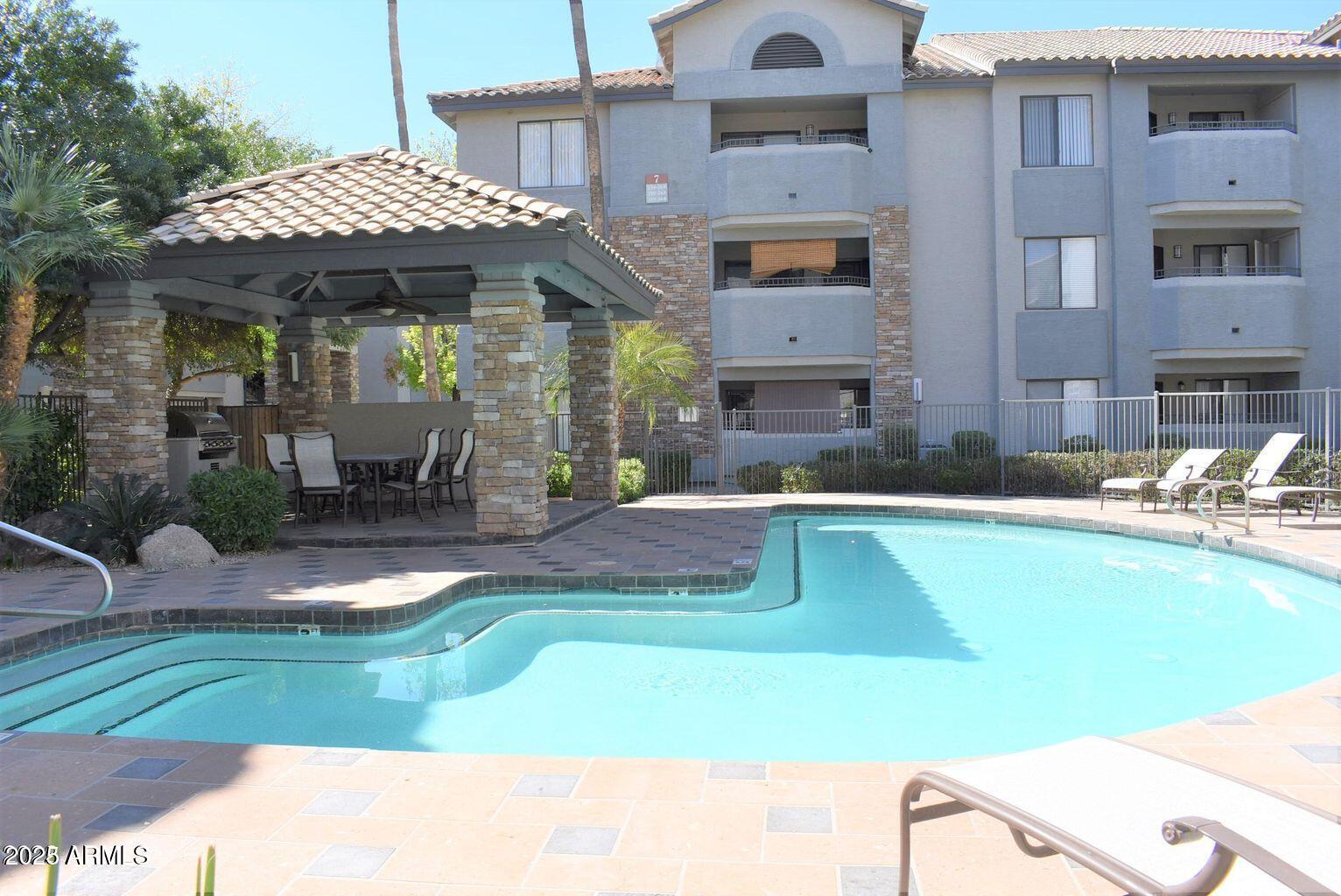 2023 East Campbell Avenue, Unit 331 Phoenix, AZ 85016 - Photo 17 of 18 a view of a house with swimming pool