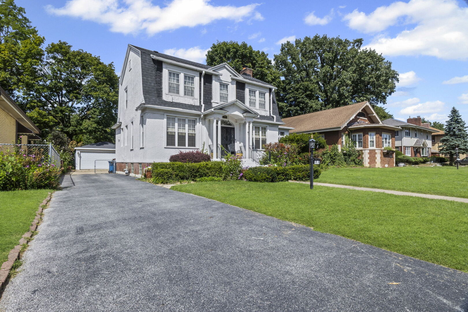 15 East 155th Street Harvey, IL 60426 - Photo 1 of 25 a front view of house with yard and green space