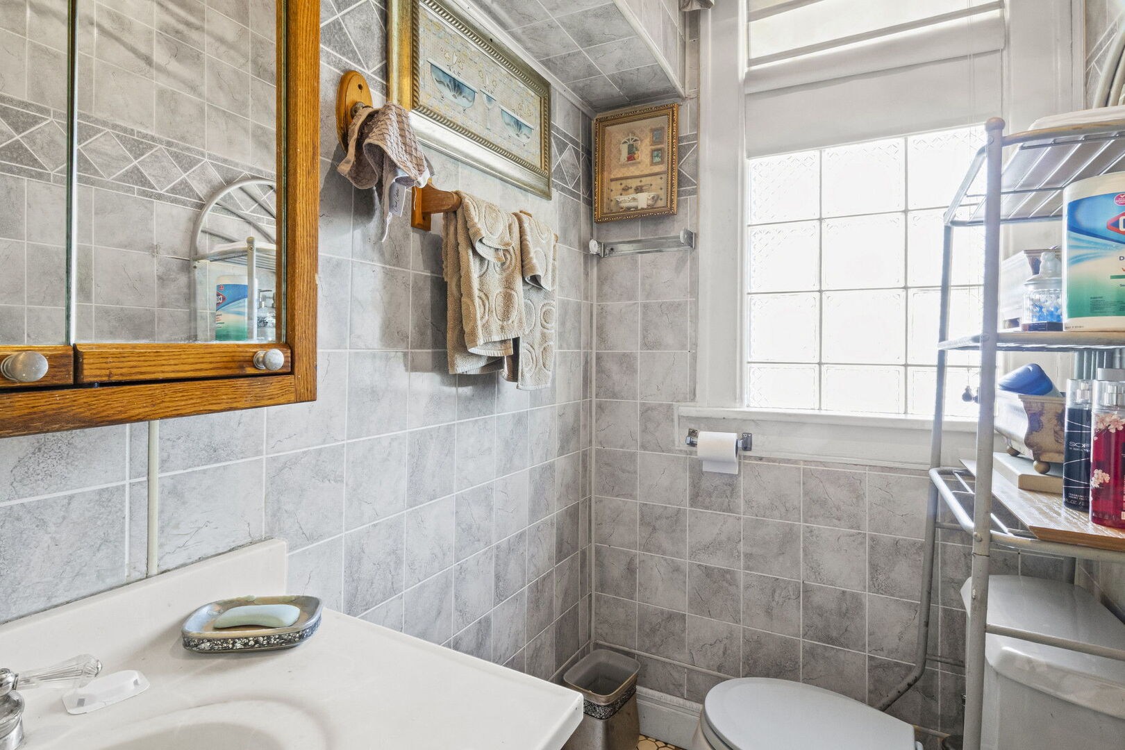15 East 155th Street Harvey, IL 60426 - Photo 14 of 25 a bathroom with a sink toilet and shower
