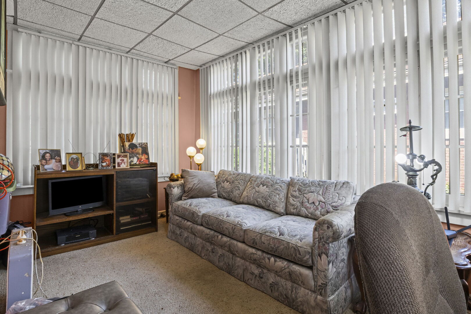 15 East 155th Street Harvey, IL 60426 - Photo 15 of 25 a living room with furniture a flat screen tv and a window
