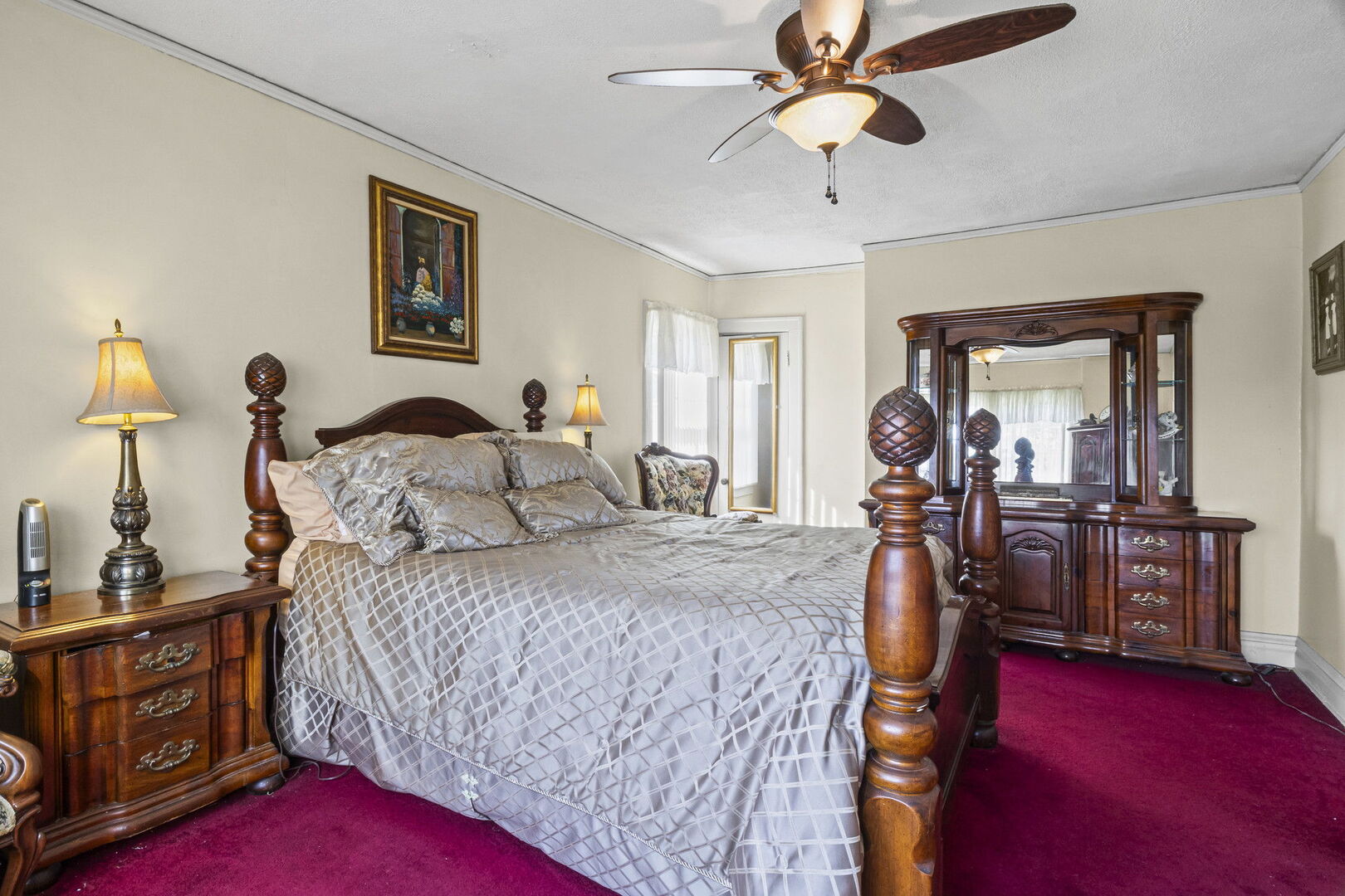 15 East 155th Street Harvey, IL 60426 - Photo 21 of 25 a bedroom with a bed and a chandelier