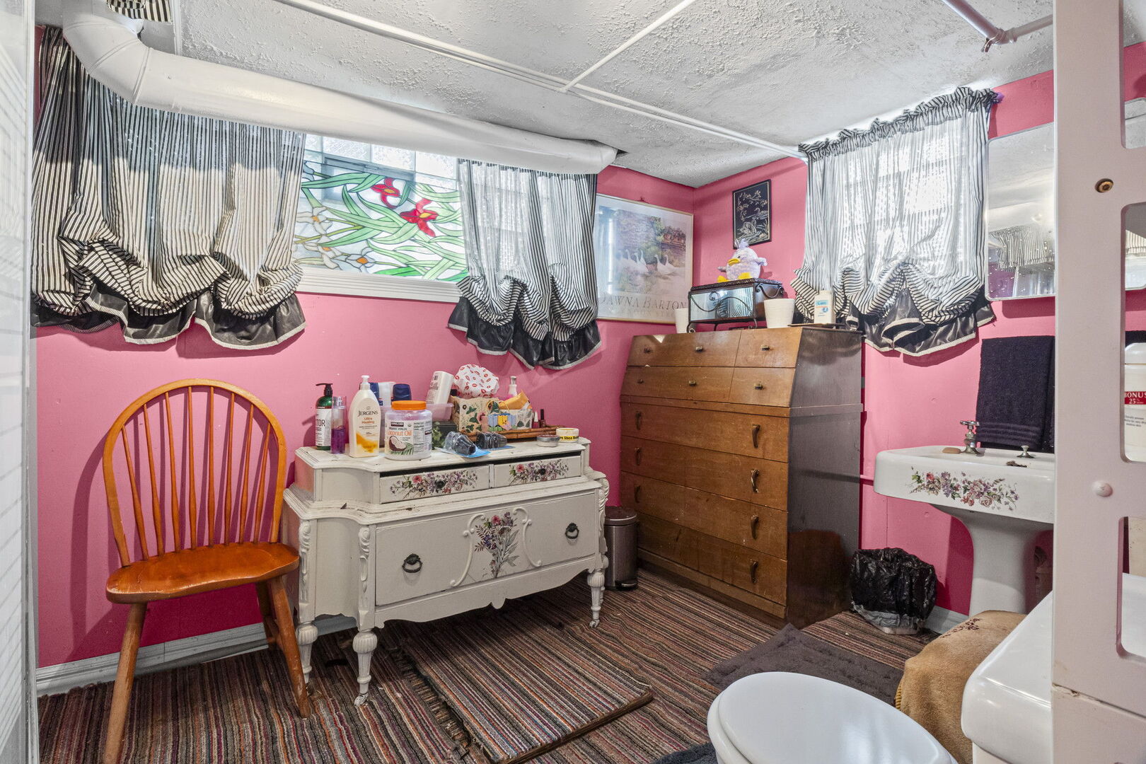 15 East 155th Street Harvey, IL 60426 - Photo 25 of 25 a living room with furniture a rug and a table