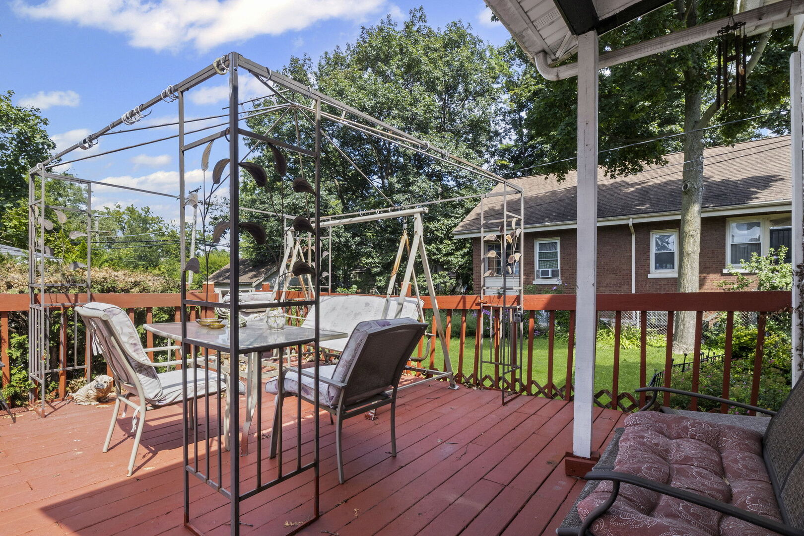 15 East 155th Street Harvey, IL 60426 - Photo 3 of 25 a view of a patio with a table chairs and backyard