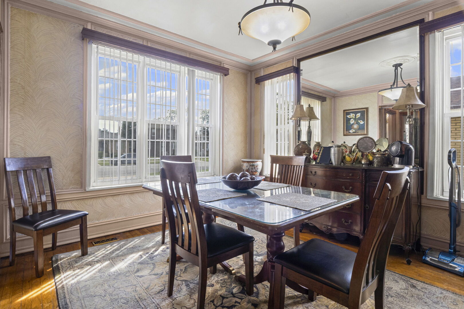 15 East 155th Street Harvey, IL 60426 - Photo 9 of 25 a view of a dining room with furniture window and wooden floor