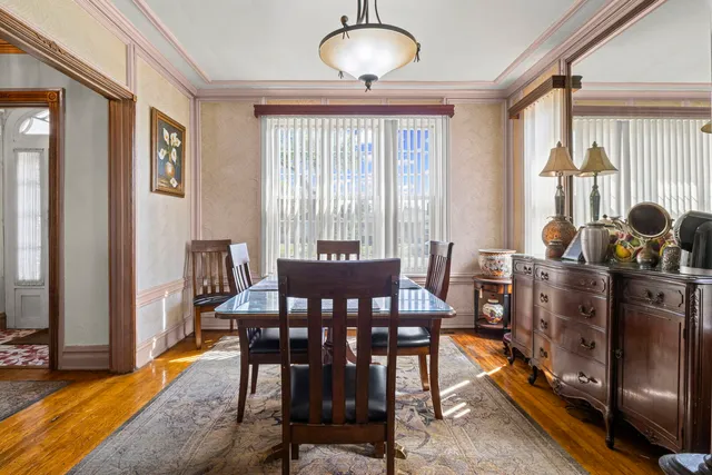 a view of a dining room with furniture and window