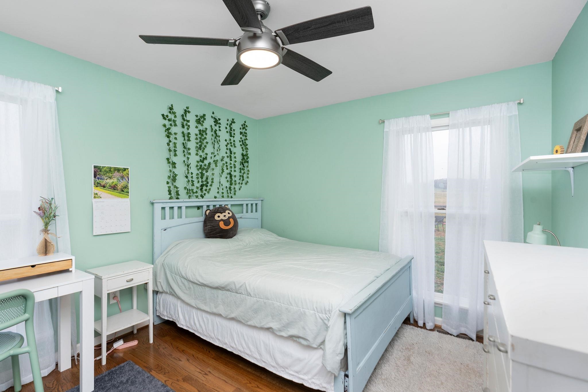 1197 Entry School Road Fishersville, VA 22939 - Photo 27 of 40 a bedroom with a bed and a chandelier