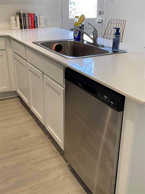 212 Marty Allen Loop Jarrell, TX 76537 - Photo 1 of 13 Streamlined cabinetry and durable countertops define this functional kitchen workspace.