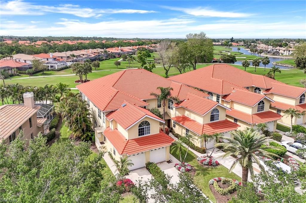 11384 Quail Village Way, Unit 203 Naples, FL 34119 - Photo 31 of 48 an aerial view of a house with a garden