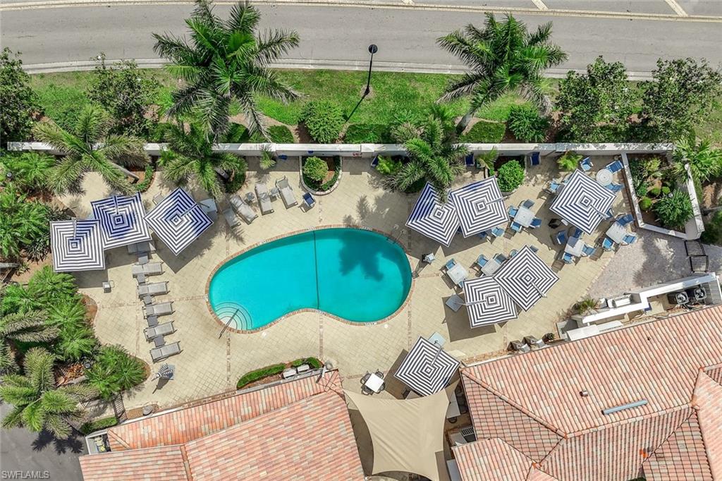 11384 Quail Village Way, Unit 203 Naples, FL 34119 - Photo 39 of 48 an aerial view of a swimming pool