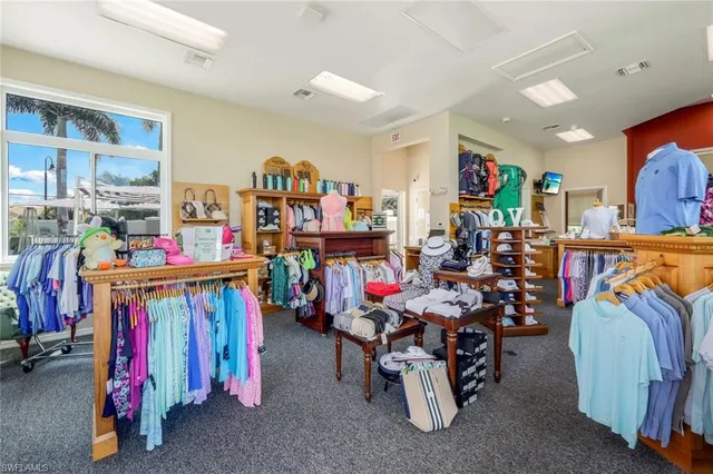 an aerial view of residential houses with outdoor space and ocean view