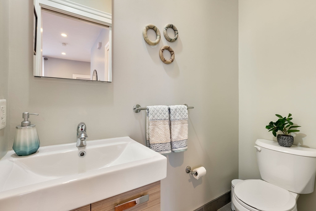 2 Tabor Place Brookline, MA 02445 - Photo 11 of 30 a bathroom with a sink mirror and toilet