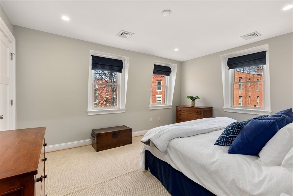 2 Tabor Place Brookline, MA 02445 - Photo 14 of 30 a bedroom with a bed and a couch