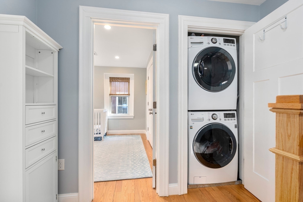 2 Tabor Place Brookline, MA 02445 - Photo 16 of 30 a view of a hallway with washer and dryer