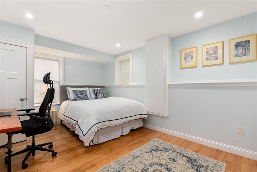2 Tabor Place Brookline, MA 02445 - Photo 21 of 30 a bedroom with a bed and wooden floor