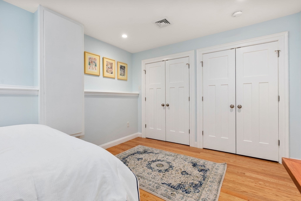 2 Tabor Place Brookline, MA 02445 - Photo 22 of 30 a bedroom with a bed and a rug