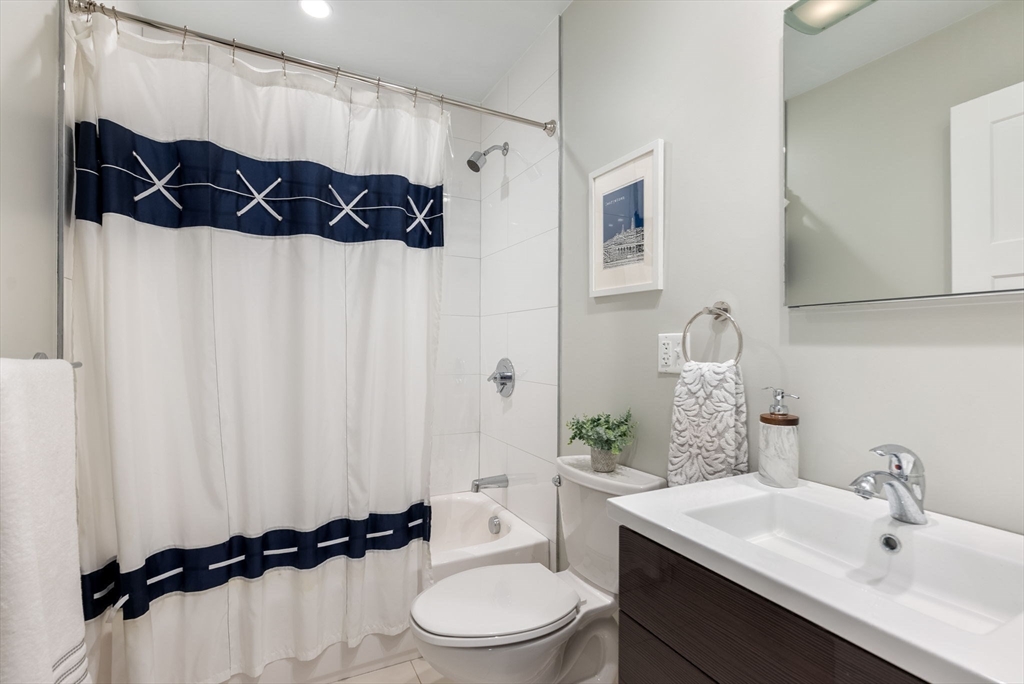 2 Tabor Place Brookline, MA 02445 - Photo 23 of 30 a bathroom with a sink a toilet and a shower