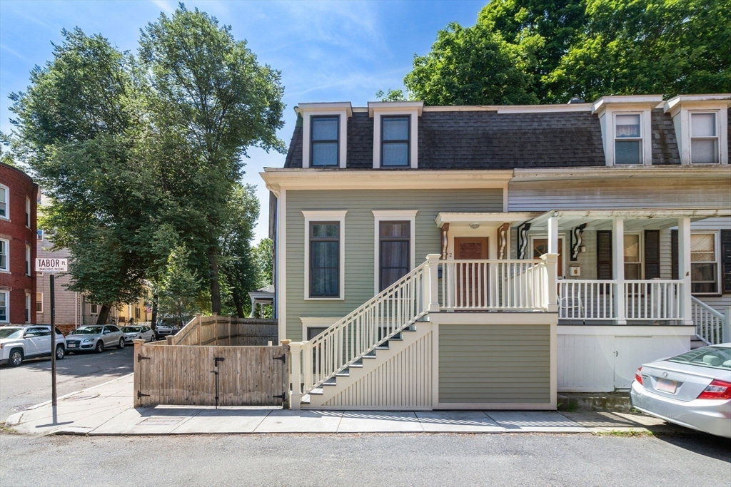 2 Tabor Place Brookline, MA 02445 - Photo 26 of 30 a view of a house with a garden