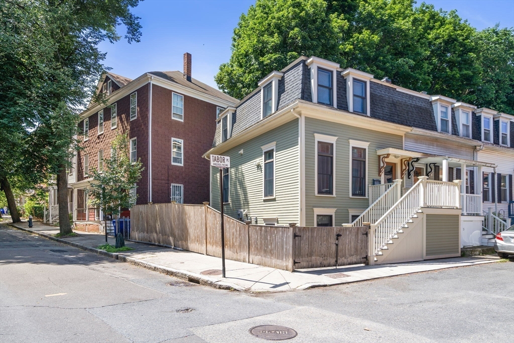2 Tabor Place Brookline, MA 02445 - Photo 27 of 30 a front view of a house with a tree