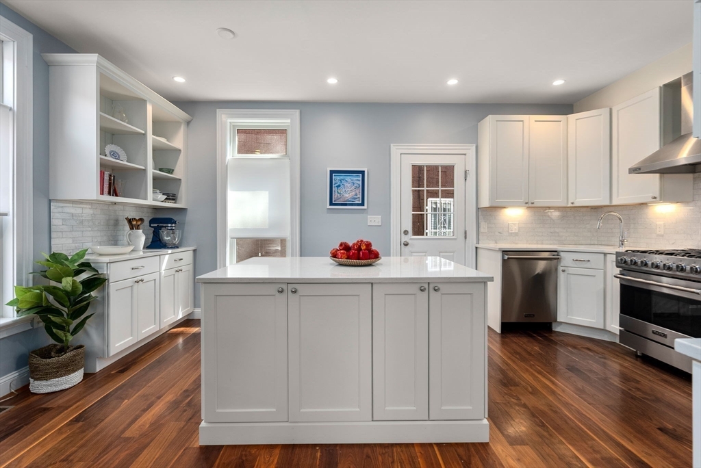 2 Tabor Place Brookline, MA 02445 - Photo 6 of 30 a kitchen with white cabinets and a stove