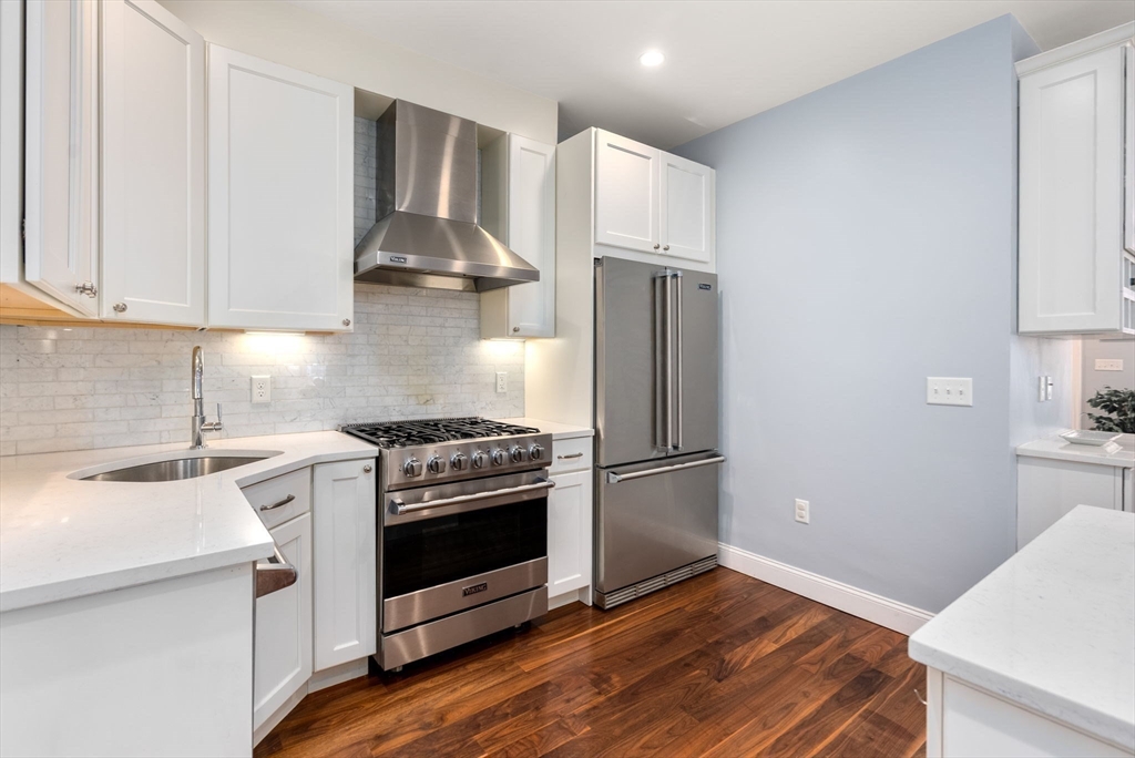 2 Tabor Place Brookline, MA 02445 - Photo 8 of 30 a kitchen with a stove and a refrigerator