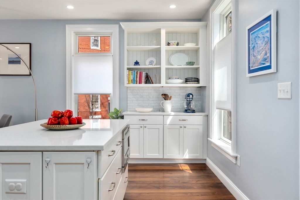 2 Tabor Place Brookline, MA 02445 - Photo 10 of 30 a kitchen with a sink cabinets and a window