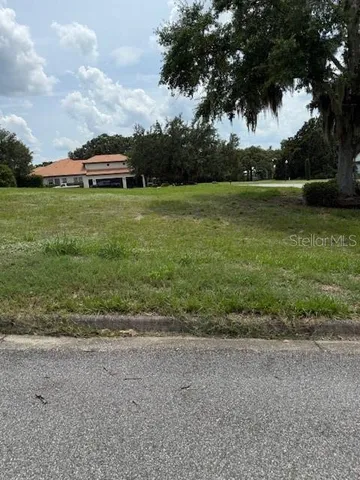 a view of a lake with a yard