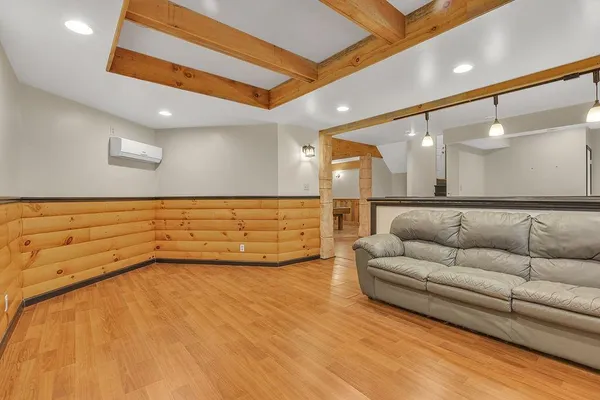 a lobby with furniture and mirror