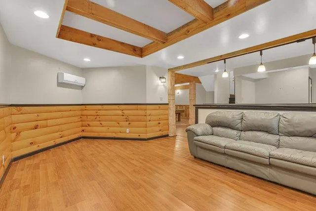 a lobby with furniture and mirror