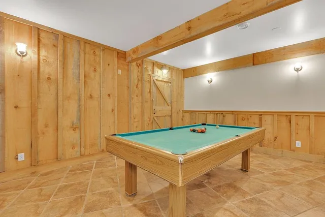 a bathroom with a granite countertop sink a toilet mirror and vanity