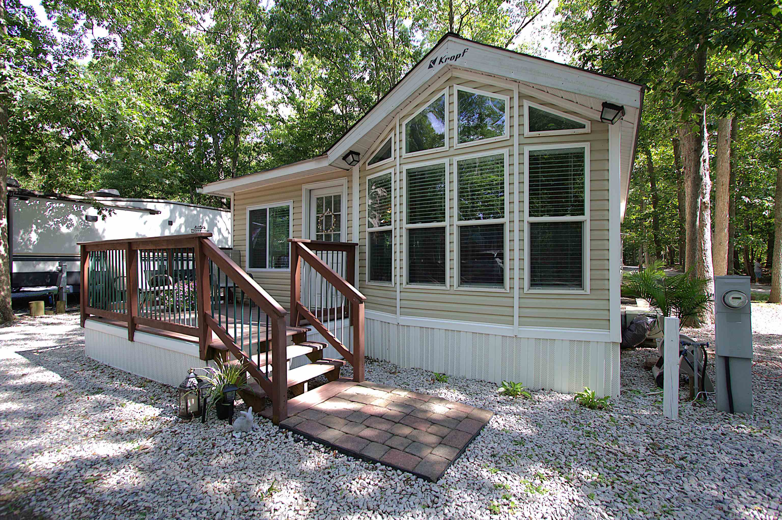 a view of an house with backyard porch and sitting area