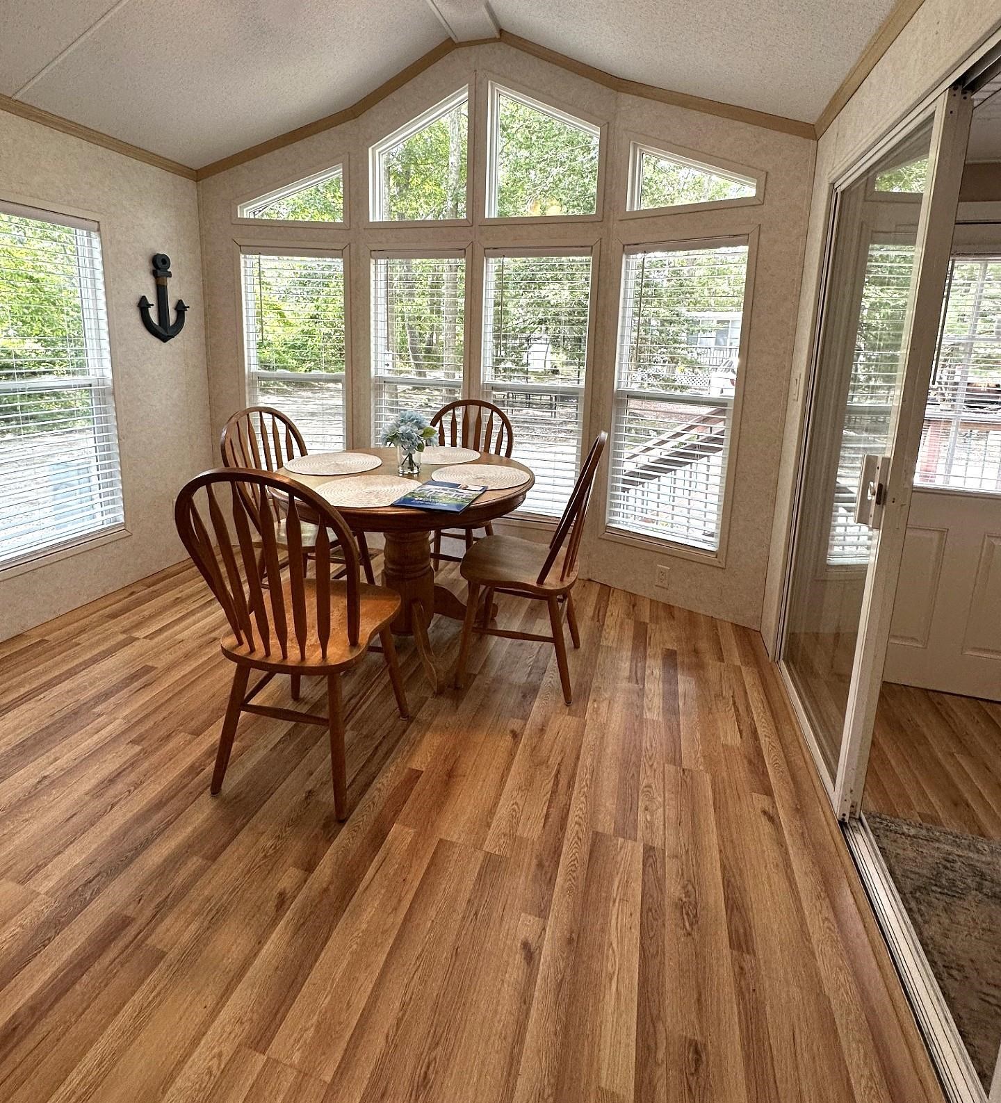 3066 North Rte 9 Ocean View, NJ 08230 - Photo 15 of 49 a view of a dining room with furniture wooden floor and a rug