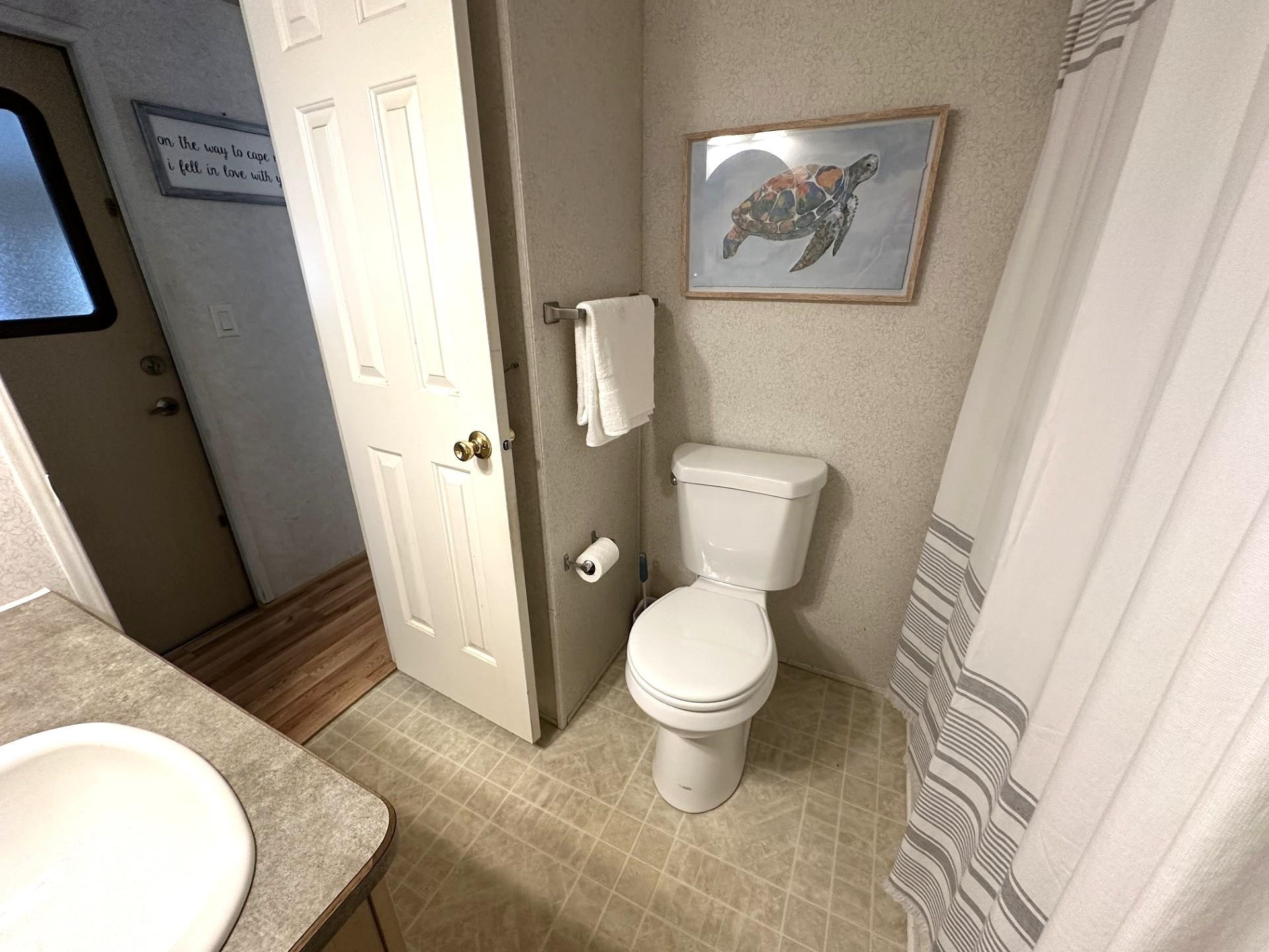 3066 North Rte 9 Ocean View, NJ 08230 - Photo 21 of 49 a bathroom with a toilet and a mirror