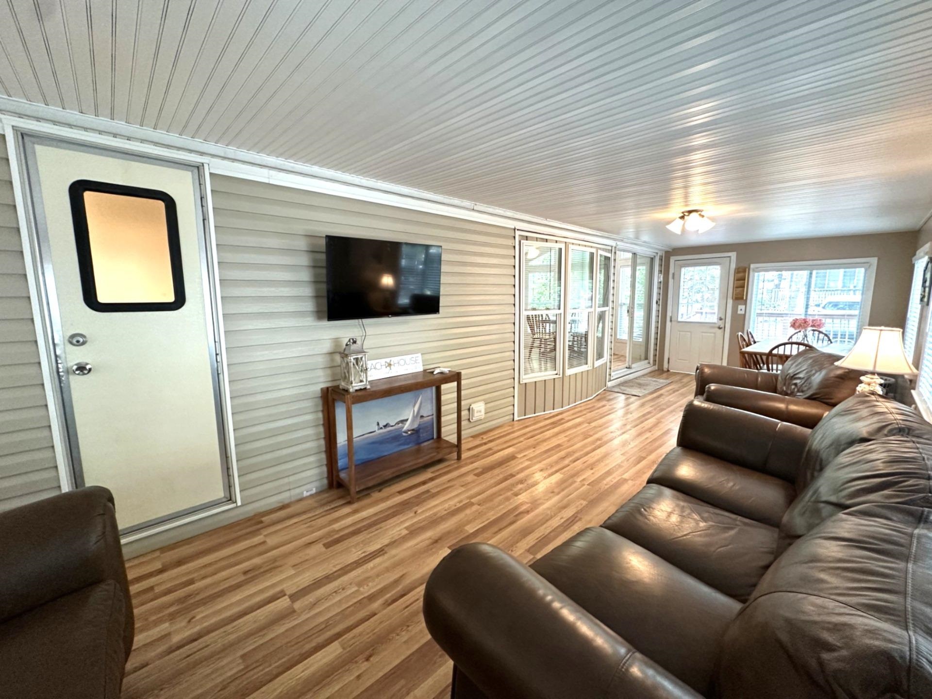 3066 North Rte 9 Ocean View, NJ 08230 - Photo 4 of 49 a living room with furniture and a flat screen tv