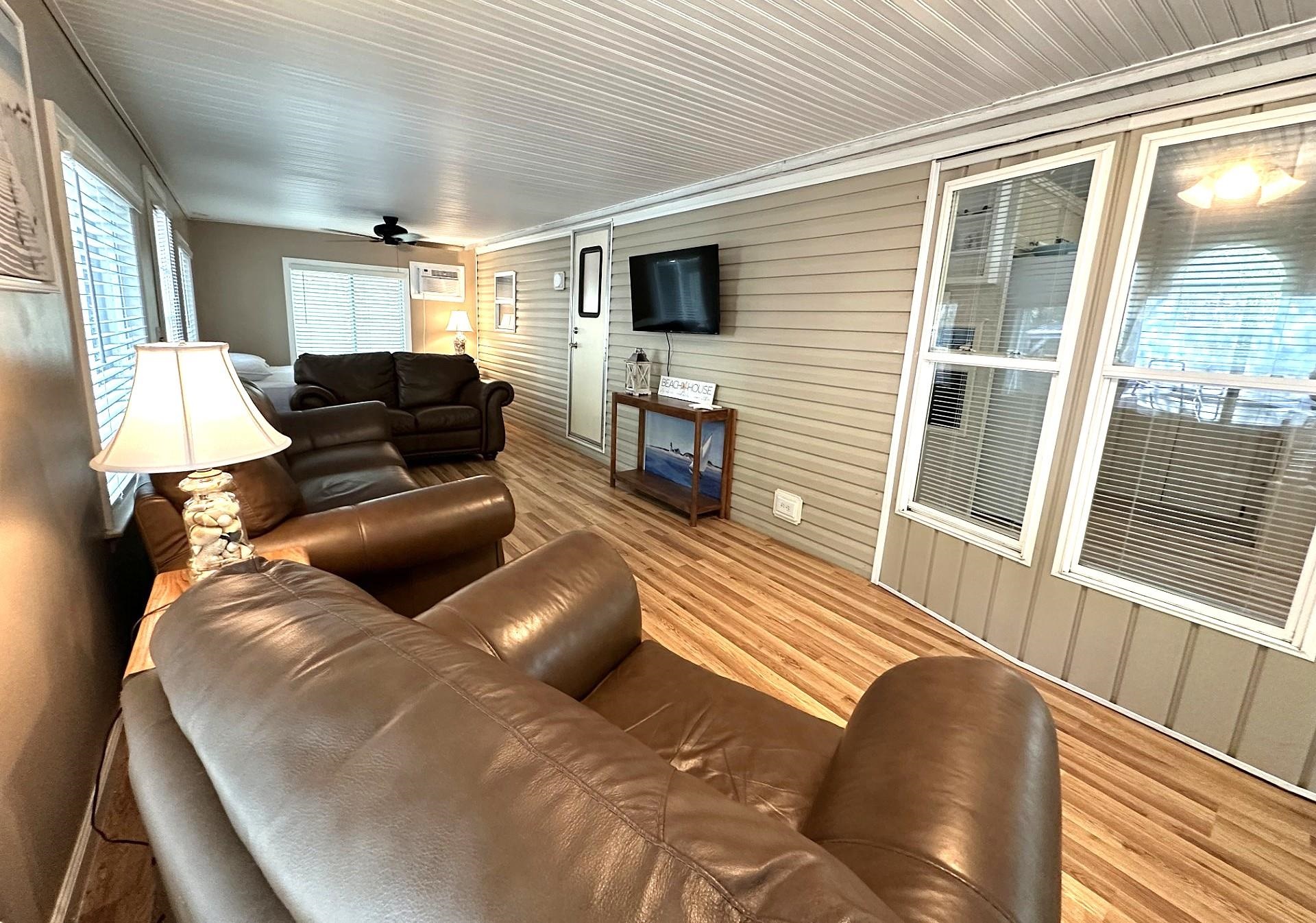 3066 North Rte 9 Ocean View, NJ 08230 - Photo 5 of 49 a living room with furniture and a flat screen tv
