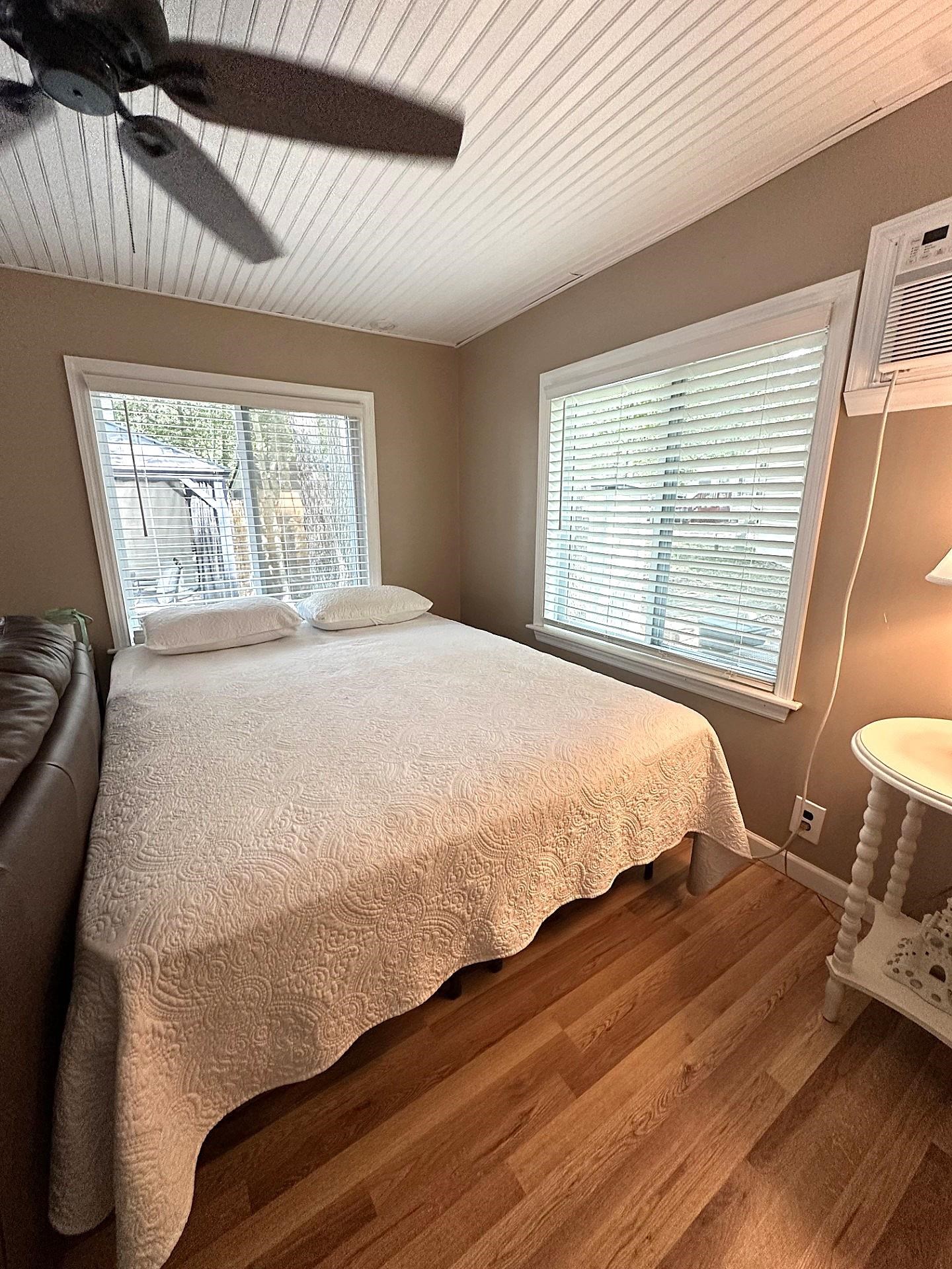 3066 North Rte 9 Ocean View, NJ 08230 - Photo 10 of 49 a large bed sitting in a bedroom next to a window