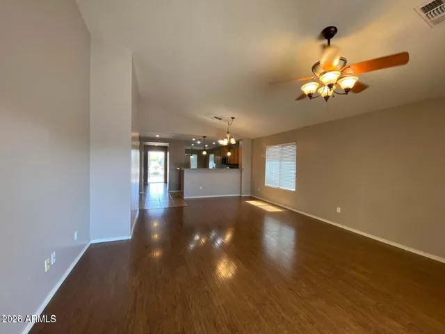 a view of an entryway with wooden floor