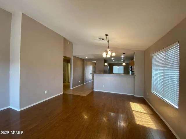 a view of a livingroom with a kitchen