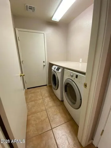 a utility room with dryer and washer