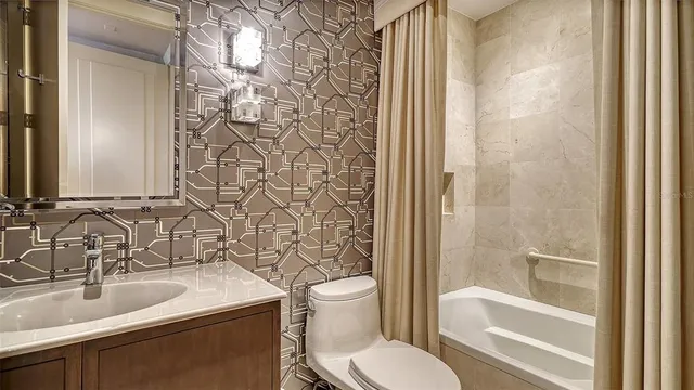 a view of a city with lush green forest