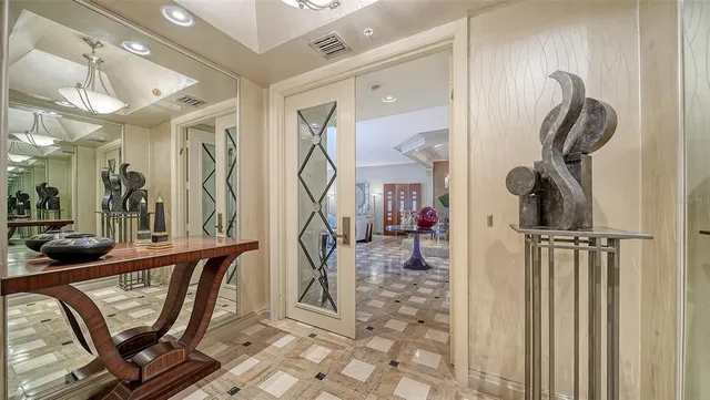 a living room with furniture and large windows