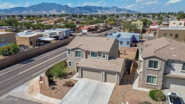 an aerial view of a house with a yard