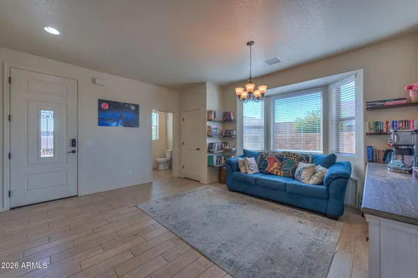 a living room with furniture and a table