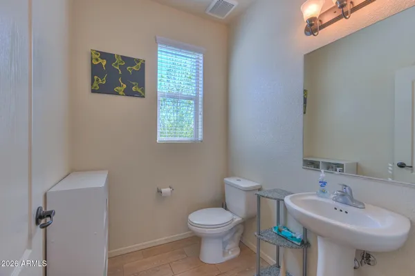 a view of a living room and kitchen with furniture