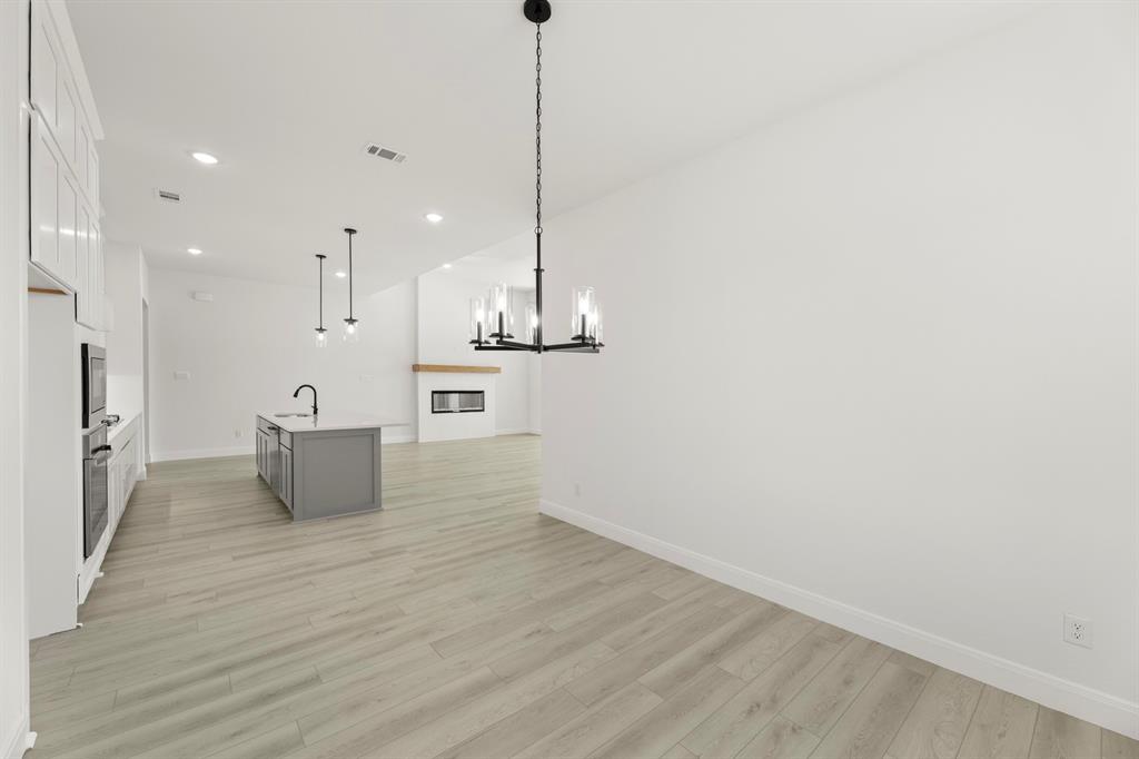 1034 Bingham Way Forney, TX 75126 - Photo 12 of 39 11_11_12. 1034 Bimgham - Dining (2)