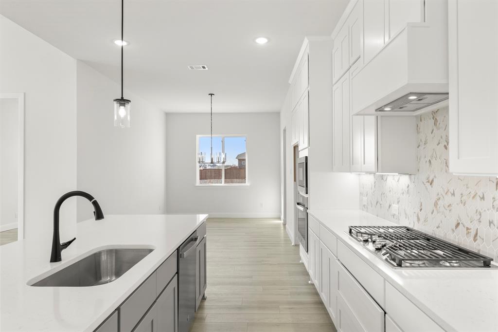 1034 Bingham Way Forney, TX 75126 - Photo 9 of 39 8_8_09. 1034 Bimgham - Kitchen (3)